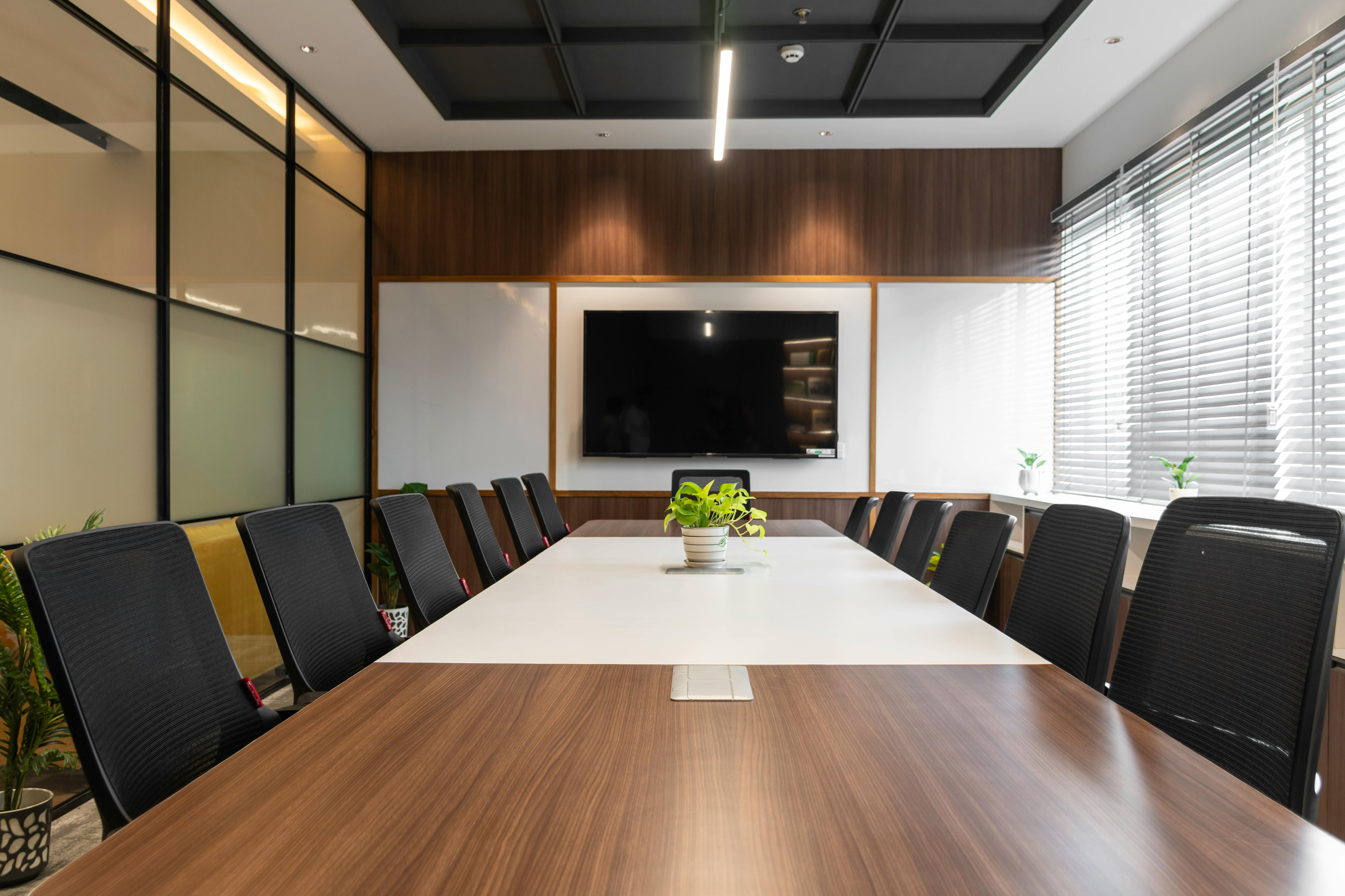 Empty boardroom with a long conference table