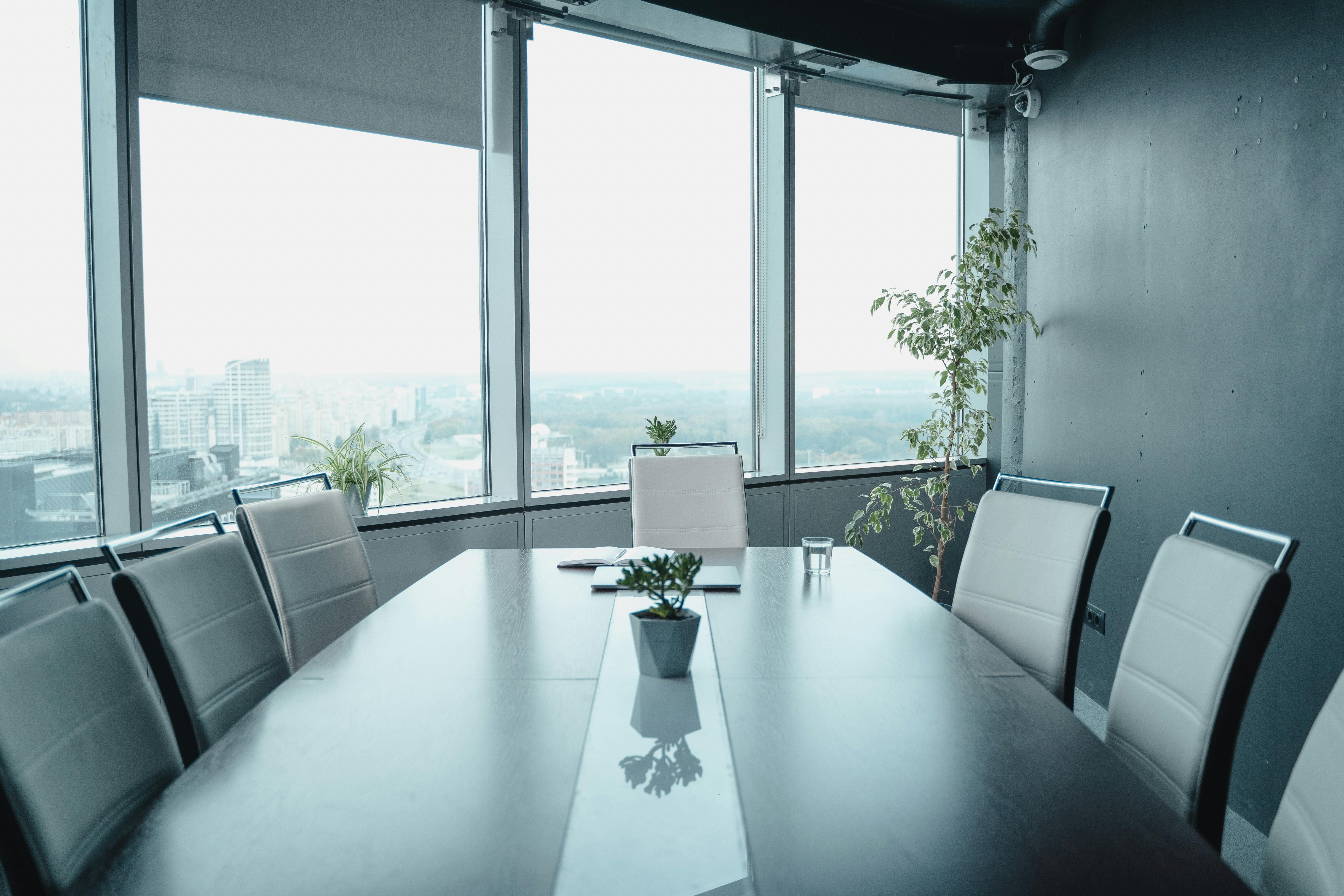 Empty conference room overlooking city buildings