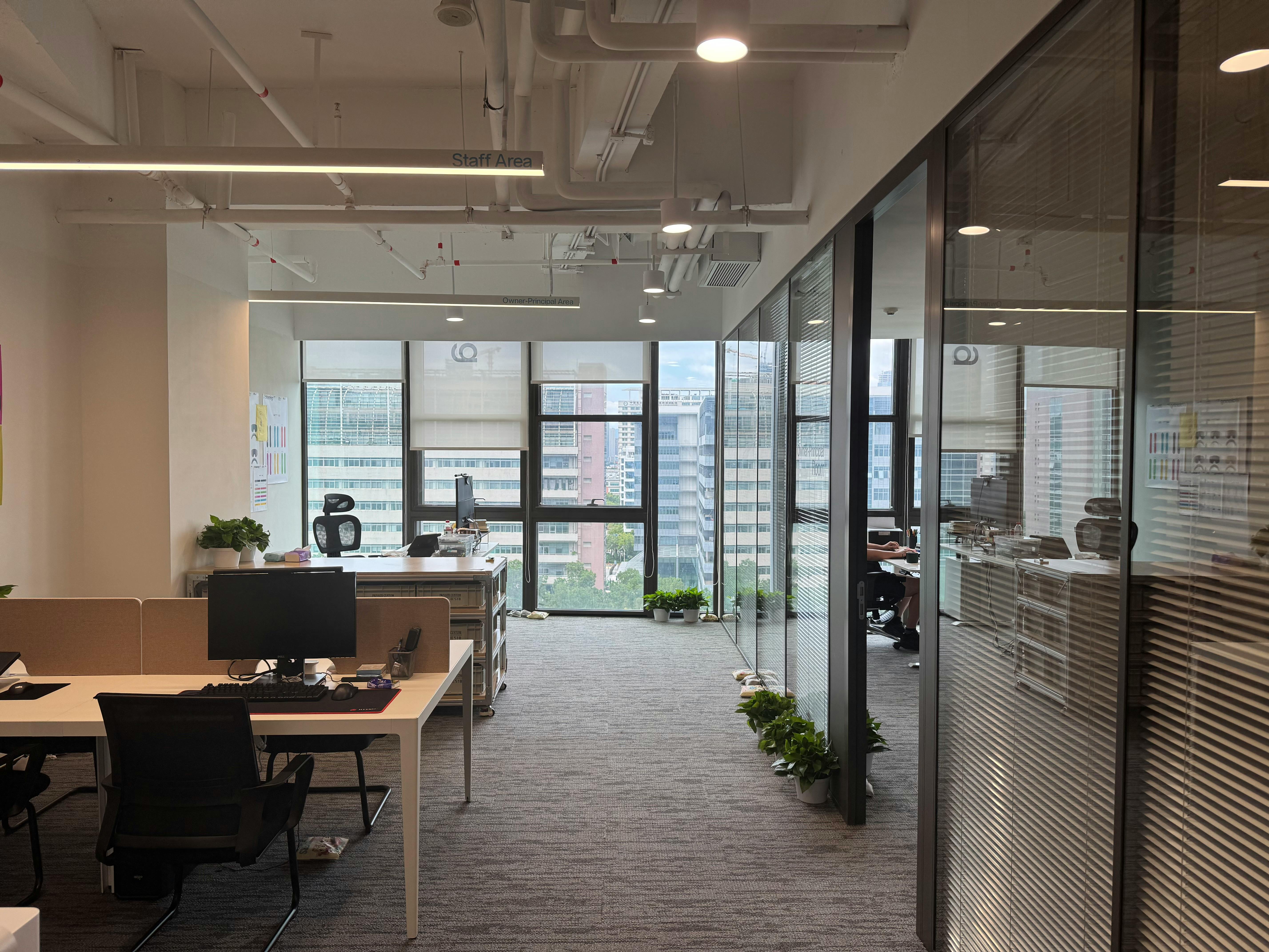 Modern office interior with desks and glass walls